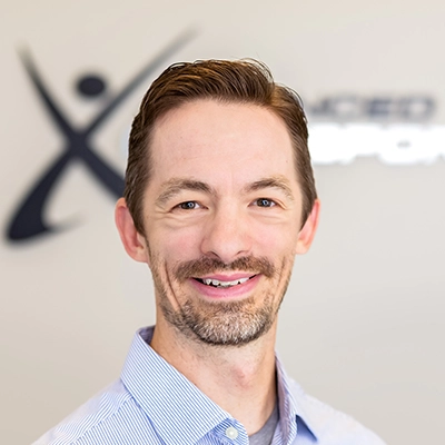Chiropractor David Findura In Dress Shirt Smiling